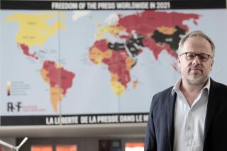 Christophe Deloire, head of RSF (Reporters without borders) stands in front of the 2021 map of press freedom in Paris, France, Tuesday April, 20, 2021. Reporters Without Borders says there has been a "dramatic deterioration" of press freedom since the pandemic tore across the world. Its new World Press Freedom Index evaluated the media in 180 countries and painted a stark picture. The group says in its annual report that 73% of nations have serious issues with media freedom. It says countries have used the pandemic "as grounds to block journalists' access to information, sources and reporting in the field." The media watchdog says it is particularly true for governments in Asia, the Mideast and Europe. (AP Photo/Lewis Joly)
