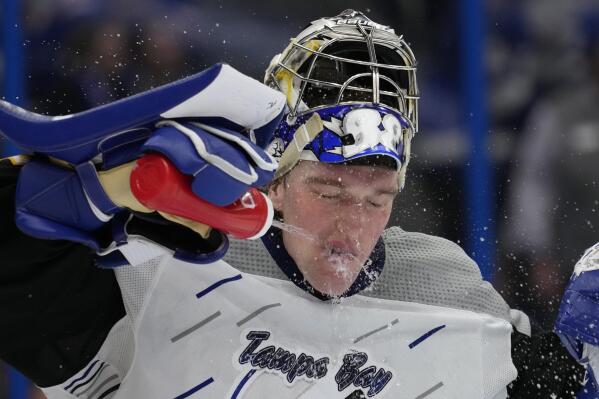 Tampa Bay Lightning goaltender Andrei Vasilevskiy (88) sprays water on his face to cool off during the third period of an NHL hockey game against the New York Rangers Thursday, Dec. 29, 2022, in Tampa, Fla. (AP Photo/Chris O'Meara)