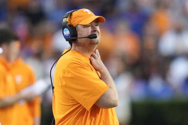 Tennessee head coach Josh Heupel watches play from the sideline during the first half of an NCAA college football game against Florida, Saturday, Sept. 16, 2023, in Gainesville, Fla. (AP Photo/John Raoux)