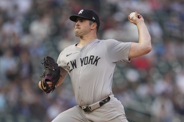 New York Yankees starting pitcher Carlos Rodón delivers during the first inning of a baseball game against the Minnesota Twins, Tuesday, May 14, 2024, in Minneapolis. (AP Photo/Abbie Parr)
