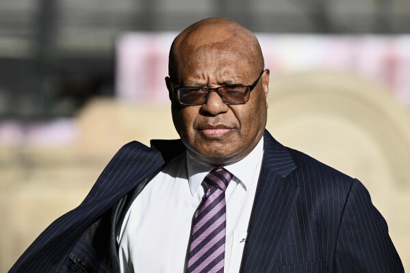 Papua New Guinea lawmaker and sidelined Petroleum Minister, Jimmy Maladina arrives at the Downing Centre Local Court in Sydney, Thursday, March 20, 2025. (Bianca De Marchi/AAP Image VIA AP)