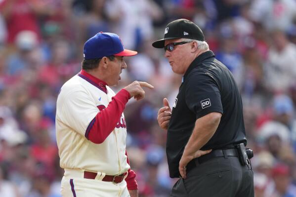 Philadelphia Phillies manager Rob Thomson, left, argues with umpire Bill Miller, right, during the sixth inning of a baseball game against the Los Angeles Dodgers, Saturday, June 10, 2023, in Philadelphia. Thomson was ejected from the game. (AP Photo/Matt Rourke)
