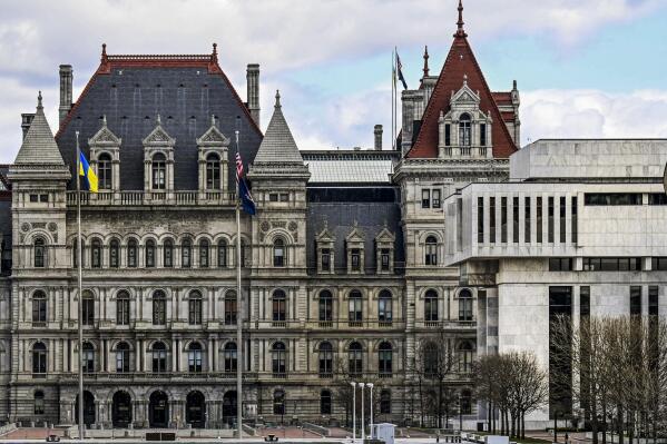 FILE - A partial views of the New York state Capitol building, left, is shown next to the state Appellate court building in foreground, right, Monday, April 4, 2022, in Albany, N.Y. A panel of five mid-level New York appellate judges have ruled on Thursday, April 21, 2022 that state Democrats engaged in gerrymandering when drawing new congressional district boundaries for the next decade. (AP Photo/Hans Pennink, File)