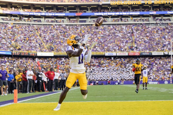 LSU wide receiver Brian Thomas Jr. (11) breaks away from Grambling State for a touchdown during an NCAA college football game in Baton Rouge, La., Saturday, Sept. 9, 2023. (AP Photo/Matthew Hinton)