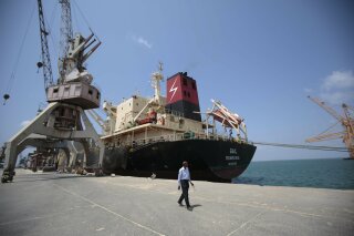 
              FILE - In this Saturday, Sept. 29, 2018, file photo, a cargo ship is docked at the port, in Hodeida, Yemen. Yemeni officials said Wednesday, Oct. 24, 2018 that the Saudi-led coalition has sent reinforcements to Yemen’s west coast ahead of a fresh assault on the rebel-held port city of Hodeida.(AP Photo/Hani Mohammed, File)
            