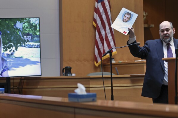 Senior Assistant New Hampshire Attorney General Benjamin Agati shows the jury a photograph of the defendant during closing arguments in Adam Montgomery's trial, Wednesday, Feb. 21, 2024, in Manchester, N.H. Montgomery is accused of killing his 5-year-old daughter Harmony, pictured at left. (Jim Davis/The Boston Globe via AP, Pool)
