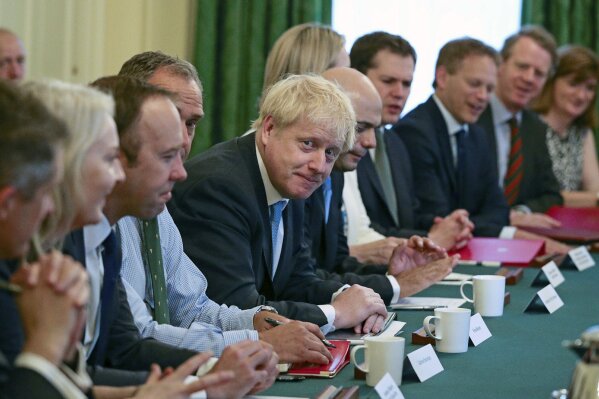 Britain's newly appointed Prime Minister Boris Johnson, centre, holds his first Cabinet meeting at Downing Street in London, Thursday July 25, 2019. Johnson held his first Cabinet meeting Thursday as prime minister, pledging to break the Brexit impasse that brought down predecessor Theresa May.(Aaron Chown/Pool via AP)