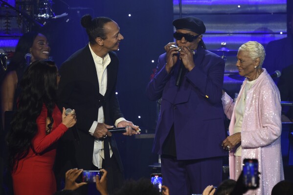 Keyshia Cole, from left, Frederic Yonnet, Stevie Wonder, and Dionne Warwick perform during the Pre-Grammy Gala on Saturday, Feb. 3, 2024, at the Beverly Hilton Hotel in Beverly Hills, Calif. (Photo by Richard Shotwell/Invision/AP)