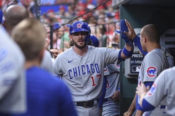 Chicago Cubs' Kris Bryant is congratulated after scoring during the second inning of the team's baseball game against the St. Louis Cardinals on Tuesday, July 20, 2021, in St. Louis. (AP Photo/Joe Puetz)