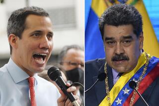 FILES - Juan Guaido, the leader of Venezuela’s National Assembly who says he is also the country’s interim president, gives a press conference in Caracas, Venezuela on Dec. 7, 2020, left, and Venezuelan President Nicolas Maduro speaks in Caracas, Venezuela on Jan. 22, 2021. The British government sought on July 19, 2021 to prevent Maduro from gaining access to nearly $2 billion of gold held by the Bank of England as the U.K. Supreme Court started hearing a case that hinges on the question of who should be considered the Latin American nation’s president. (AP Photo/Ariana Cubillos and Matias Delacroix, File)
