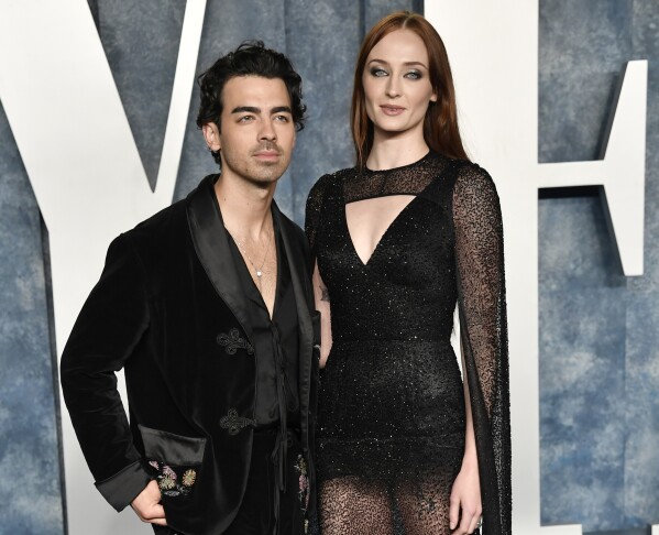 FILE - Joe Jonas, left, and Sophie Turner appear at the Vanity Fair Oscar Party on March 12, 2023, at the Wallis Annenberg Center in Beverly Hills, Calif. Jonas has filed for divorce from Turner after four years of marriage and two children. The 34-year-old Jonas Brothers singer filed to end his marriage with the 27-year-old star of “Game of Thrones” and “X-Men” actor on Tuesday, Sept. 5, 2023, in a Florida court. (Photo by Evan Agostini/Invision/AP, File)