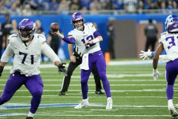 Minnesota Vikings quarterback Nick Mullens (12) throws during the second half of an NFL football game against the Detroit Lions, Sunday, Jan. 7, 2024, in Detroit. (AP Photo/Paul Sancya)