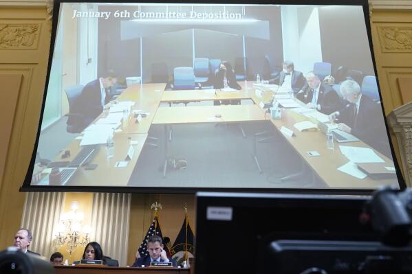 A video of a deposition of Jeffrey Clark is displayed as the House select committee investigating the Jan. 6 attack on the U.S. Capitol continues to reveal its findings of a year-long investigation, at the Capitol in Washington, Thursday, June 23, 2022. (AP Photo/Jacquelyn Martin)