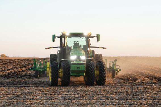 This 2021 photo provided by John Deere shows an autonomous tractor plowing a field, without a driver, on a farm in Blue Earth, Minn. (Bill Krzyzanowski/John Deere via AP)