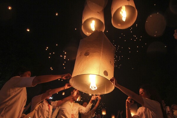 People release lanterns during the celebration of Vesak, which marks the day of Buddha's birth, death and enlightenment at the 9th century Borobudur Temple in Magelang, Central Java, Indonesia, Thursday, May 23, 2024. (AP Photo/Slamet Riyadi)