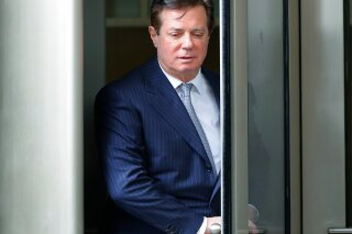 
              FILE - In this Feb. 14, 2018, file photo, Paul Manafort leaves the federal courthouse in Washington. The trial of President Donald Trump’s former campaign chairman will open this week with tales of lavish spending on properties and clothing and allegations that the political consultant laundered money through offshore bank accounts. What’s likely to be missing: answers about whether the Trump campaign colluded with Russia during the 2016 presidential election.  (AP Photo/Pablo Martinez Monsivais, File)
            