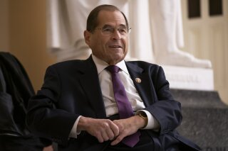 FILE - In this July 26, 2019, file photo, House Judiciary Committee Chairman Jerrold Nadler, D-N.Y., prepares for a television news interview at the Capitol in Washington. While more than 130 House Democrats _ more than half of the caucus _ have come out in favor of an impeachment inquiry into President Donald Trump, according to a tally by The Associated Press, those numbers don’t reflect the whole story. The number of Democrats who would actually vote to recommend articles of impeachment, at this point, is significantly smaller. (AP Photo/J. Scott Applewhite, File)