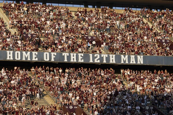 FILE - Texas A&M fans cheer as the team takes the field for an NCAA college football game against Vanderbilt on Sept. 26, 2020, in College Station, Texas. The 12th Man Foundation, which supports Texas A&M athletics, announced Wednesday, Aug. 9, 2023, it is closing the branch set up for donors to support endorsement deals for Aggies athletes. The 12th Man Foundation said it will still engage in name, image and likeness activities with Aggies athletes using “unrestricted donations.” (AP Photo/David J. Phillip, File)