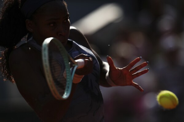 Coco Gauff of the U.S. returns the ball to United States' Sofia Kenin during their third round match of the French Tennis Open, at the Roland-Garros stadium, in Paris, Saturday, May 31, 2025. (AP Photo/Christophe Ena)