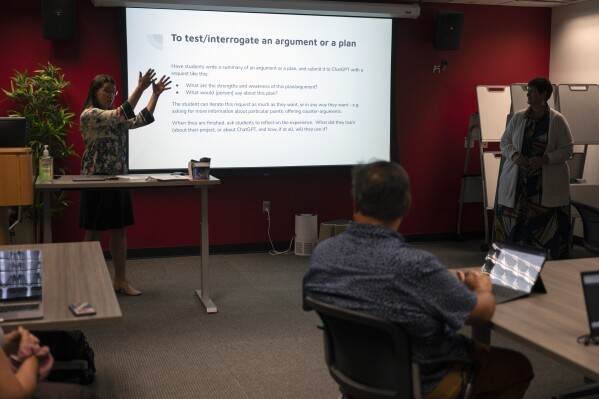 Lori Anne Salem, Assistant Vice Provost and Director of the Student Success Center, left, hosts a faculty teaching circle on artificial intelligence on Wednesday, Aug. 9, 2023, at Temple University in Philadelphia. Educators say they want to embrace the technology’s potential to teach and learn in new ways, but when it comes to assessing students, they see a need to “ChatGPT-proof” test questions and assignments. (AP Photo/Joe Lamberti)