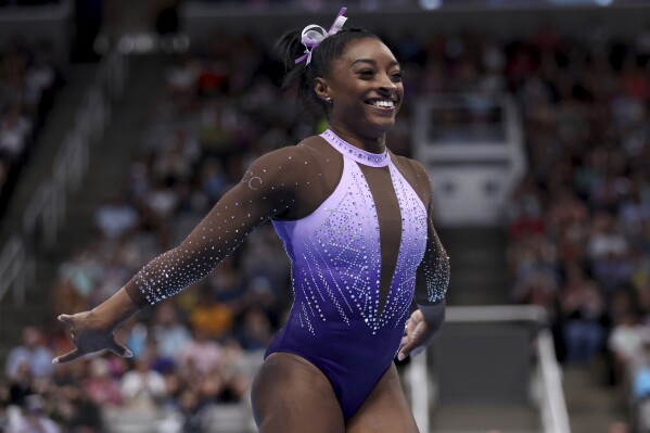 Simone Biles celebrates after competing in the floor exercise at the U.S. Gymnastics Championships, Friday, Aug. 25, 2023, in San Jose, Calif. (AP Photo/Jed Jacobsohn)