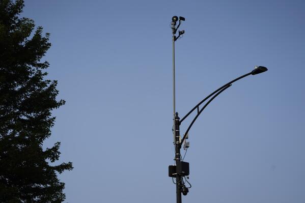 ShotSpotter equipment overlooks the intersection of South Stony Island Avenue and East 63rd Street in Chicago on Tuesday, Aug. 10, 2021. An Associated Press investigation, based on a review of thousands of internal documents, emails, presentations and confidential contracts, along with interviews with dozens of public defenders in communities where ShotSpotter has been deployed, has identified a number of serious flaws in using ShotSpotter as evidentiary support for prosecutions. (AP Photo/Charles Rex Arbogast)