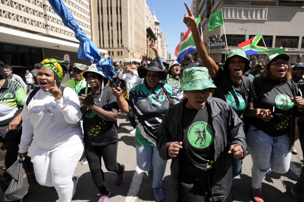 File - Supporters of former South Africa's president Jacob Zuma sing and dance outside the south Gauteng High court in Johannesburg, South Africa, Thursday, April 11, 2024. The ANC lost a second court case against the uMkhonto weSizwe (MK) rival party led by former President Jacob Zuma on Monday April 22, 2024 when a judge dismissed the ANC's case alleging copyright infringement against the MK Party for using a name and a logo. (AP Photo/Themba Hadebe, file)