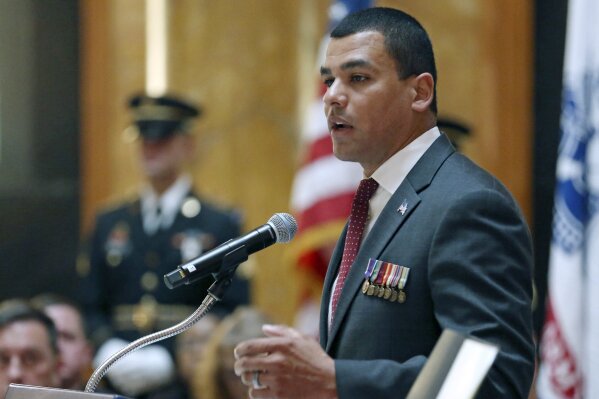 In this Nov. 11, 2019 photo, Massachusetts Veterans' Services Secretary Francisco Urena speaks during the State House Veterans Day ceremony in Boston. An independent investigation released Wednesday, June 24, 2020, said the leadership of the Holyoke Soldiers' Home in Holyoke, Mass., made "substantial errors and failures" as the coronavirus began to spread. Urena said he was asked to resign ahead of the release of the report. (Angela Rowlings/Boston Herald via AP)
