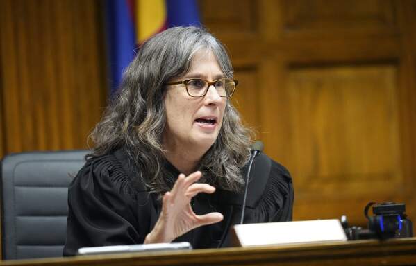 Judge Sarah B. Wallace presides over closing arguments in a hearing for a lawsuit to keep former President Donald Trump off the state ballot, Wednesday, Nov. 15, 2023, in Denver. (AP Photo/Jack Dempsey, Pool)