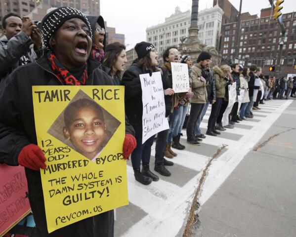 FILE- Demonstrators block Public Square on Nov. 25, 2014, in Cleveland, during a protest over the police shooting of 12-year-old Tamir Rice. A series of shootings by white Ohio police officers of Black adults and children in recent years and subsequent protests have led to calls for changes in policing in the state and new requirements for the use of force. (AP Photo/Tony Dejak, File)