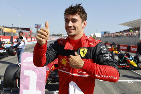 Ferrari driver Charles Leclerc of Monaco celebrates after he clocked the fastest time during the qualifying session for the French Formula One Grand Prix at Paul Ricard racetrack in Le Castellet, southern France, Saturday, July 23, 2022. The French Grand Prix will be held on Sunday. (Eric Gaillard, Pool via AP)