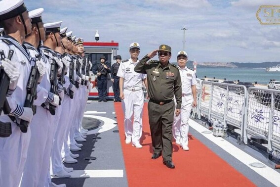 In this photo released by the official Facebook page of the Ream Naval Base, former Cambodian Defense Minister Tea Banh, second from right, reviews navy members before a training at Ream Naval Base in Sihanoukville, southwestern of Phnom Penh, Cambodia, Sunday, Dec. 3, 2023. (Ream Naval Base's Facebook page via 鶹ýapp)