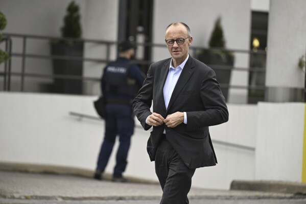Germany's Chancellor Friedrich Merz walks before his meeting with Finland's Prime Minister Petteri Orpo in Turku, Finland, May 26, 2025. (Roni Rekomaa/Lehtikuva via AP)