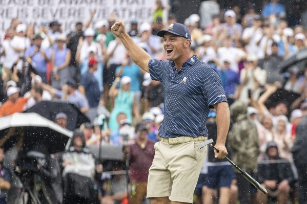 Captain Bryson DeChambeau, of Crushers GC, celebrates after winning on the 18th green during the final round of LIV Golf Greenbrier at The Old White at The Greenbrier, Sunday, Aug. 6, 2023, in White Sulfur Springs, W.Va. (Mike Stobe/LIV Golf via AP)