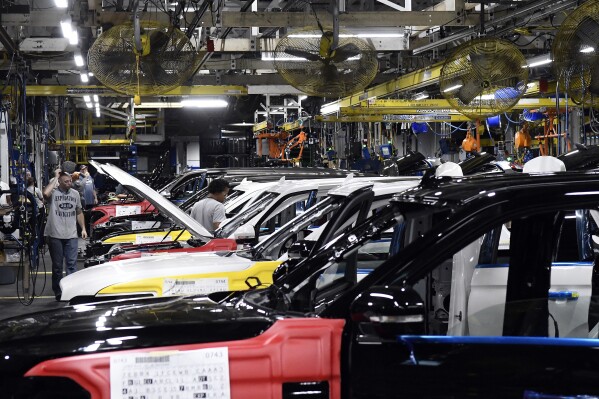 FILE - Workers assemble Ford trucks at the Ford Kentucky Truck Plant, Friday, Oct. 27, 2017, in Louisville, Ky. The United Auto Workers union said Friday, Feb. 16, 2024, members will go on strike Feb. 23 at the Kentucky Truck Plant, Ford’s most profitable factory, if a local contract dispute is not resolved. (AP Photo/Timothy D. Easley, File)