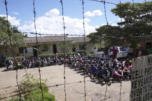 Prisoners gather inside Chikurubi Maximum prison before their release on the outskirts of the capital Harare, Thursday, April 18, 2024. Zimbabwe President Emmerson Mnangagwa has granted amnesty to more than 4,000 prisoners in an independence day amnesty. The amnesty coincided with the country's 44th anniversary of independence from white minority rule on Thursday and included some prisoners who were on death row. (AP Photo/Tsvangirayi Mukwazhi)