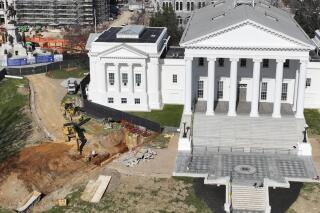 FILE - Workers begin digging a tunnel to connect the new General Assembly building to the Capitol, March 2, 2022, in Richmond, Va. Dena Potter, a spokeswoman for the state agency overseeing the project, said the Capitol was briefly evacuated on March 14, 2022, after a contractor working on the $25 million tunnel “inadvertently” poked through the ceiling of a subterranean Capitol extension causing debris to fall into the visitors center cafe. (AP Photo/Steve Helber, File)