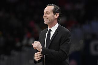 FILE - Brooklyn Nets coach Kenny Atkinson watches during the first half of the team's NBA basketball game against the Washington Wizards, Feb. 1, 2020, in Washington. The Charlotte Hornets have agreed to terms on a contract with Atkinson, now a Golden State Warriors assistant, to become their next coach, according to a person familiar with the situation. The person spoke to The Associated Press on condition of anonymity Friday because Atkinson has not yet signed the contract. (AP Photo/Nick Wass, File)