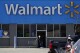 FILE - A woman pushes a shopping cart at a Walmart in Rolling Meadows, Ill., on Nov. 5, 2020. Walmart reports earnings on Thursday, Nov. 16, 2023. (AP Photo/Nam Y. Huh, File)