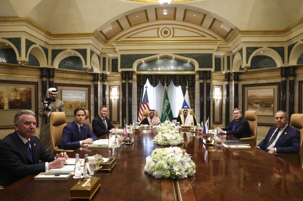 U.S. Secretary of State Marco Rubio, second left, meets with Saudi Foreign Minister Prince Faisal bin Farhan Al Saud, Saudi National Security Advisor Mosaad bin Mohammad Al-Aiban, U.S. National Security Advisor Mike Waltz, third left, U.S. Middle East envoy Steve Witkoff, left, Russian Foreign Minister Sergei Lavrov, right, and Russian President Vladimir Putin's foreign policy advisor Yuri Ushakov, second right, at Diriyah Palace, in Riyadh, Saudi Arabia, Tuesday Feb. 18, 2025. (Evelyn Hockstein/Pool Photo via AP)