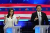 Republican presidential candidates former U.N. Ambassador Nikki Haley and Florida Gov. Ron DeSantis talk during a Republican presidential primary debate hosted by NBC News, Wednesday, Nov. 8, 2023, at the Adrienne Arsht Center for the Performing Arts of Miami-Dade County in Miami. (AP Photo/Rebecca Blackwell)