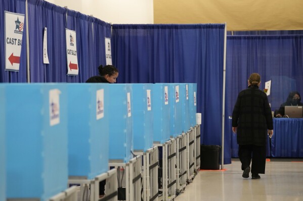 A voter casts a ballot at Chicago Loop Super Site in Chicago, Tuesday, March 19, 2024. Illinois residents will vote Tuesday to narrow Democratic and GOP candidate fields in key U.S. House races. (AP Photo/Nam Y. Huh)