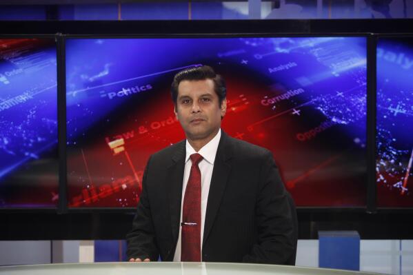 Senior Pakistani journalist Arshad Sharif poses for photograph prior to recoding an episode of  his talk show at a studio, in Islamabad, Pakistan, Dec. 15, 2016. Sharif, 50, had been in hiding abroad after leaving Pakistan to avoid arrest on charges of criticizing his country's powerful military. Sharif was shot and killed by police after the car he was in sped up instead of halting at a roadblock near Nairobi, the police said Monday, Oct. 24, 2022. The police said it was a case of "mistaken identity" during a search for a similar car involved in a case of child abduction. (AP Photo)