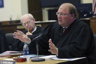 FILE- In this Sept. 17, 2015 file photo, Wisconsin Supreme Court Justice Michael J. Gableman speaks during a court hearing at the Grant County Courthouse in Lancaster, Wis. Nearly half of the money being spent on a Republican-ordered investigation into Wisconsin’s 2020 presidential election is earmarked for data analysis. That is what a contract released Wednesday, Sept, 1, 2021 to The Associated Press under Wisconsin's open records law shows. It spells out how the $676,000 in taxpayer money will be spent. The contract was entered into by Assembly Speaker Robin Vos and former Wisconsin Supreme Court Justice Michael Gableman, who is leading the probe. (Jessica Reilly/Telegraph Herald via AP)