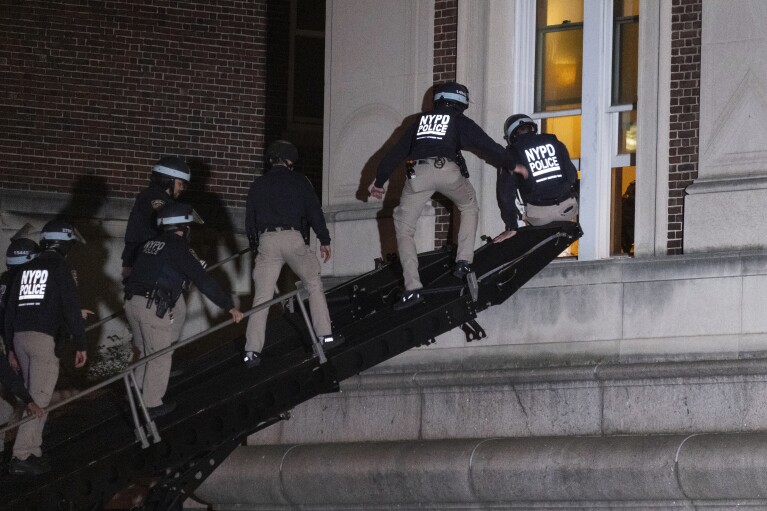 New York City police enter an upper floor of Hamilton Hall on the Columbia University campus using a tactical vehicle, in New York Tuesday, April 30, 2024, after a building was taken over by protesters earlier Tuesday. (AP Photo/Craig Ruttle)