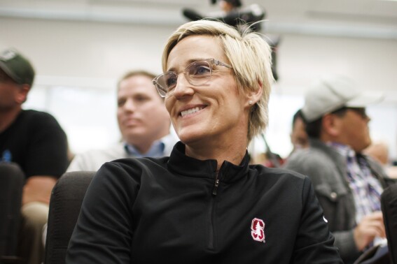 Stanford associate head coach Kate Paye listens to VanDerveer during a news conference in Stanford, Calif., Wednesday, April 10, 2024. VanDerveer, the winningest basketball coach in NCAA history, announced her retirement Tuesday night after 38 seasons leading the Stanford women's team and 45 years overall. (Dai Sugano/Bay Area News Group via AP)