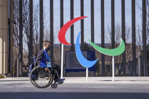 Italy's Matteo Remotti Martini moves in front of the Agitos outside the Paralympic Village ahead of the Beijing 2022 Winter Paralympic Games, Beijing, China, Thursday, March 3, 2022. (Thomas Lovelock/OIS via AP)