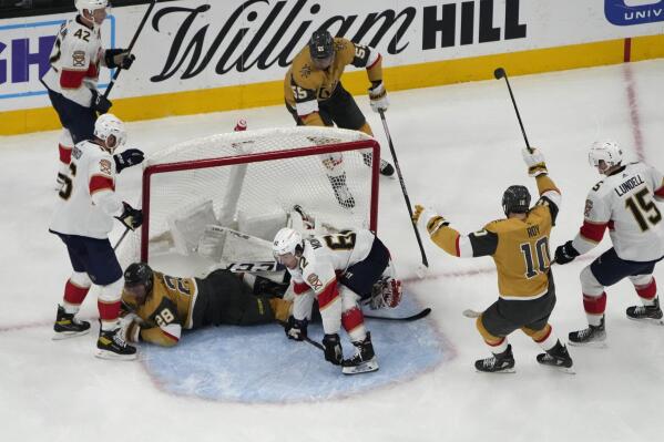 Vegas Golden Knights center Nicolas Roy (10) and right wing Keegan Kolesar (55) celebrate after left wing William Carrier (28) scored against the Florida Panthers during the third period of an NHL hockey game Thursday, Jan. 12, 2023, in Las Vegas. (AP Photo/John Locher)