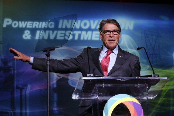 FILE - In this May 30, 2019, file photo,  Energy Secretary Rick Perry speaks at an energy summit in Salt Lake City. A business executive Perry recommended as an adviser to Ukraine’s government exaggerated his military credentials, according to veterans who examined his record. Robert Joseph Bensh claimed to have been a member of the U.S. military’s most elite units: Army Rangers, Special Forces and Delta Force. But a summary of his military career shows he spent less than five years in uniform, almost all of it with the Army National Guard. (AP Photo/Rick Bowmer, File)