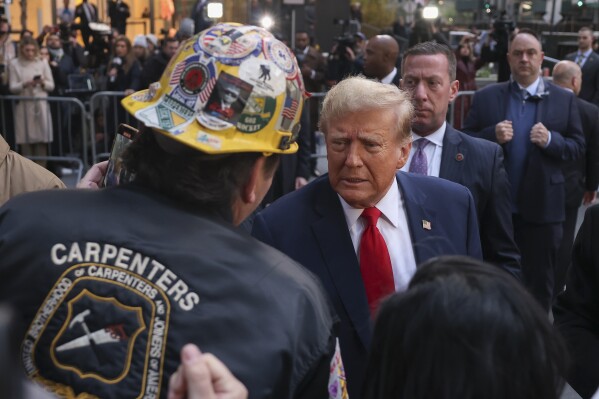 Former President Donald Trump speaks with construction workers at the construction site of the new JPMorgan Chase headquarters in midtown Manhattan, Thursday, April 25, 2024, in New York. Trump met with construction workers and union representatives hours before he's set to appear in court. (AP Photo/Yuki Iwamura)